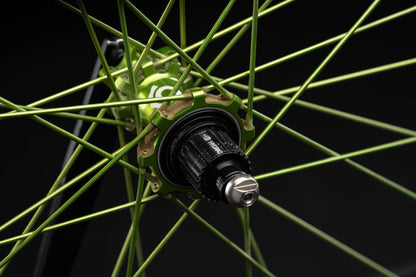 Close-up of a lime bicycle wheel with a black background