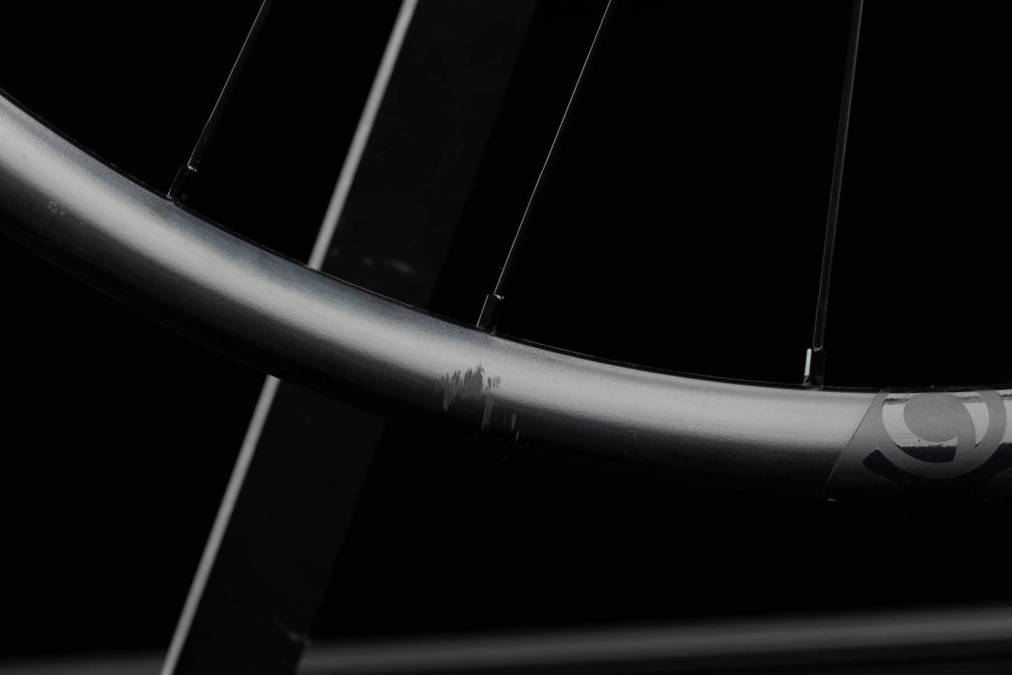 Close-up of a bicycle rim with a blurred background