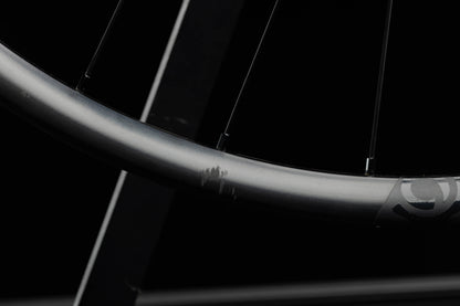 Close-up of a bicycle rim with a blurred background